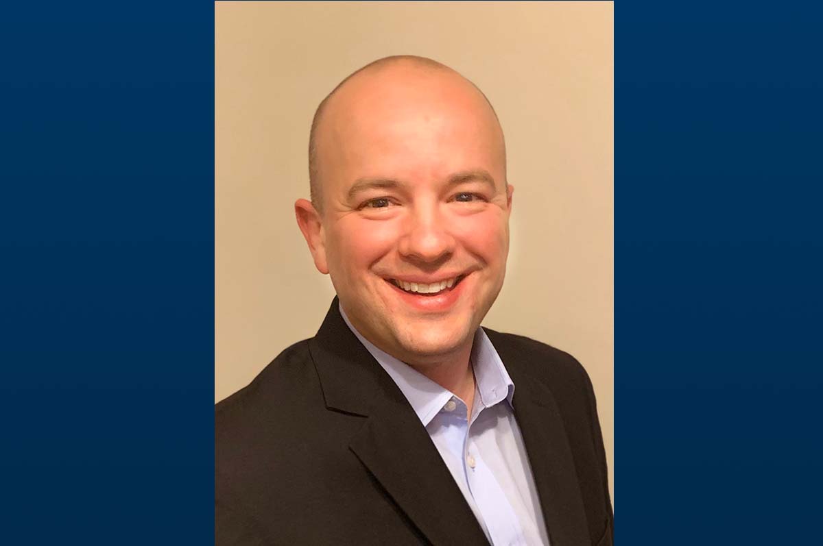 Portrait of man in dark suit